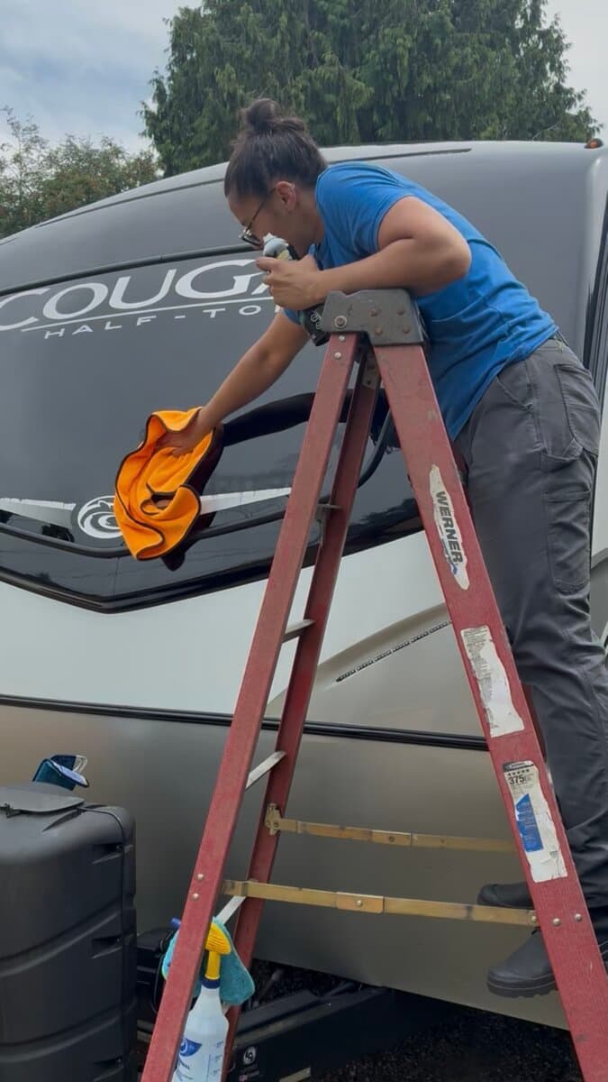 Detailing the front cap of a Cougar fifth wheel